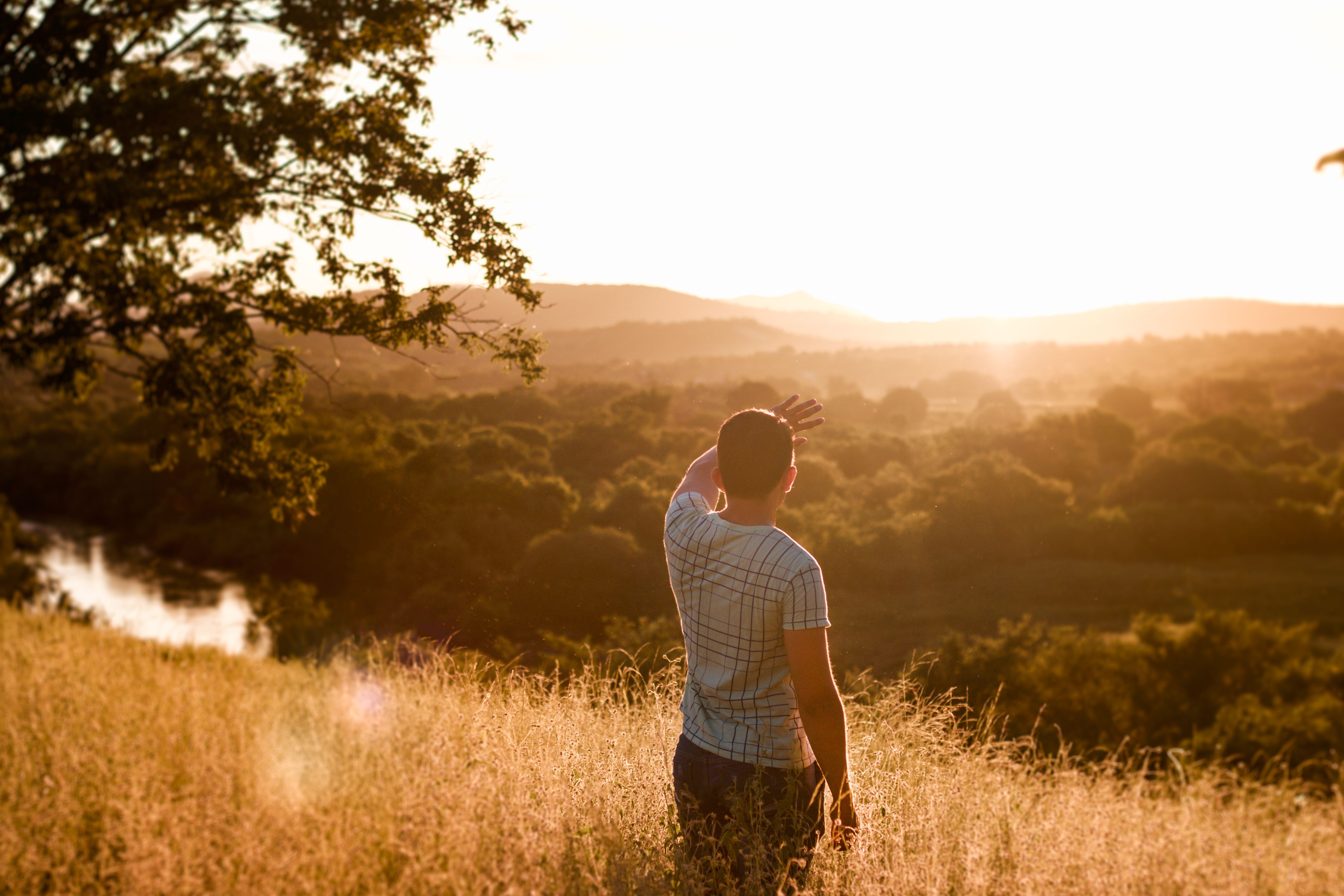 Man Standing on Grass Field · Free Stock Photo