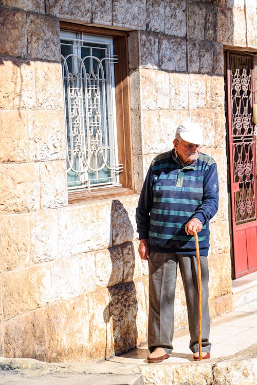 Elderly Man Using a Walking Stick