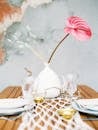 Plates and Culterly for Two and a Vase with Plants