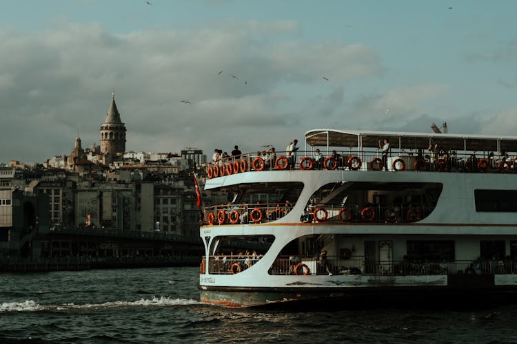 Cruise Ship Sailing On Canal In City