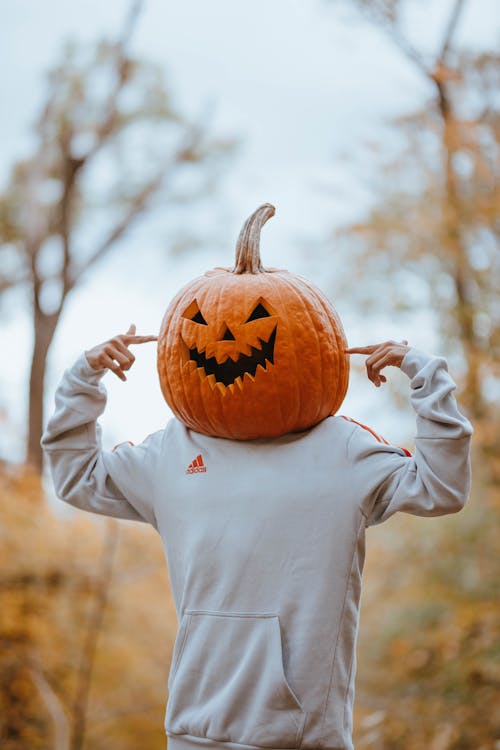 Free Person with Pumpkin on Head Stock Photo
