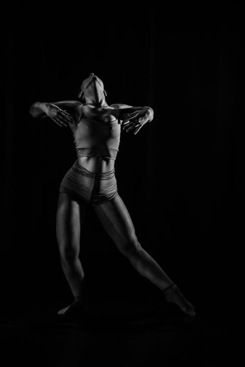 Ballet Dancer Against Black Background 