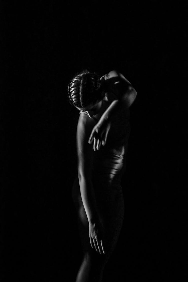 Silhouette Of Ballet Female Dancer In Dark