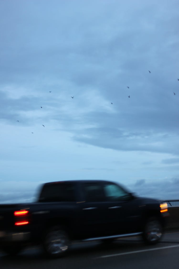 A Pick Up Car Moving On The Road