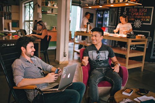 Free Photograph of Men Having Conversation Seating on Chair Stock Photo