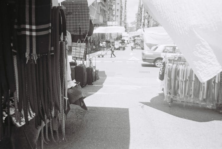 Vintage Black And White Photography Of A City Market With Clothing