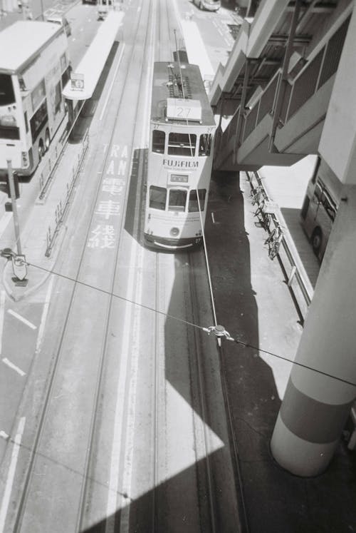 A High Angle Shot of a Double Decker Bus Beside Staircase