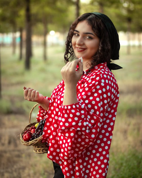 Woman in Red Polka Dots Top