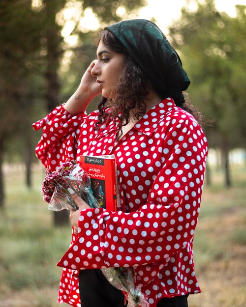 Shallow Focus of a Woman Wearing Her Red Polka Dot Blouse