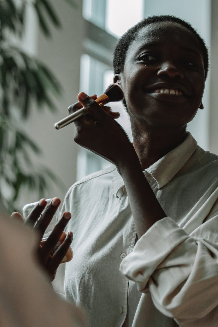 A Woman Putting On Makeup