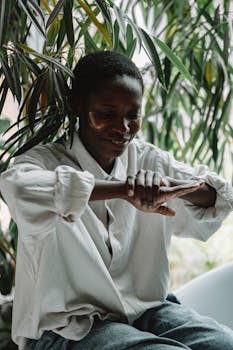 African woman wearing under eye patches. Indoor scene with a natural vibe.
