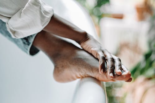 A Person Washing their Feet