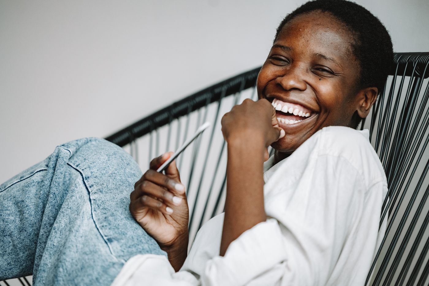 Woman laughing naturally, bunny lines Botox in Houston