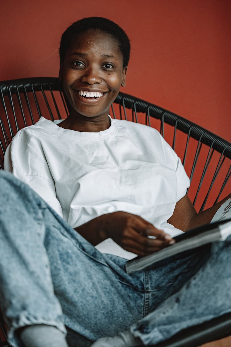 Smiling Woman Reading Magazine