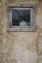 A Tea Kettle on a Wooden Framed Window