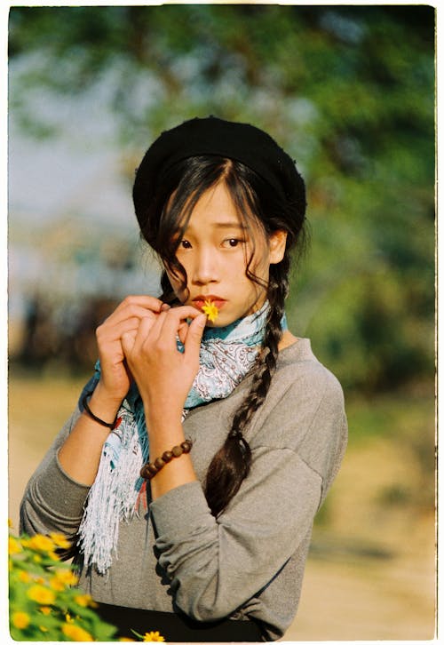 Girl with Braids in Rural Scenery