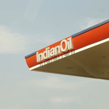 Close-up view of Indian Oil Corporation's petrol station canopy against clear sky. — photo by Shivansh  Sharma