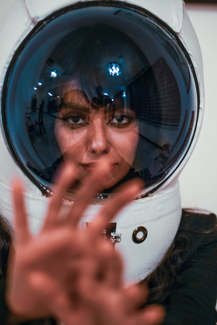 A Woman Wearing A Space Helmet