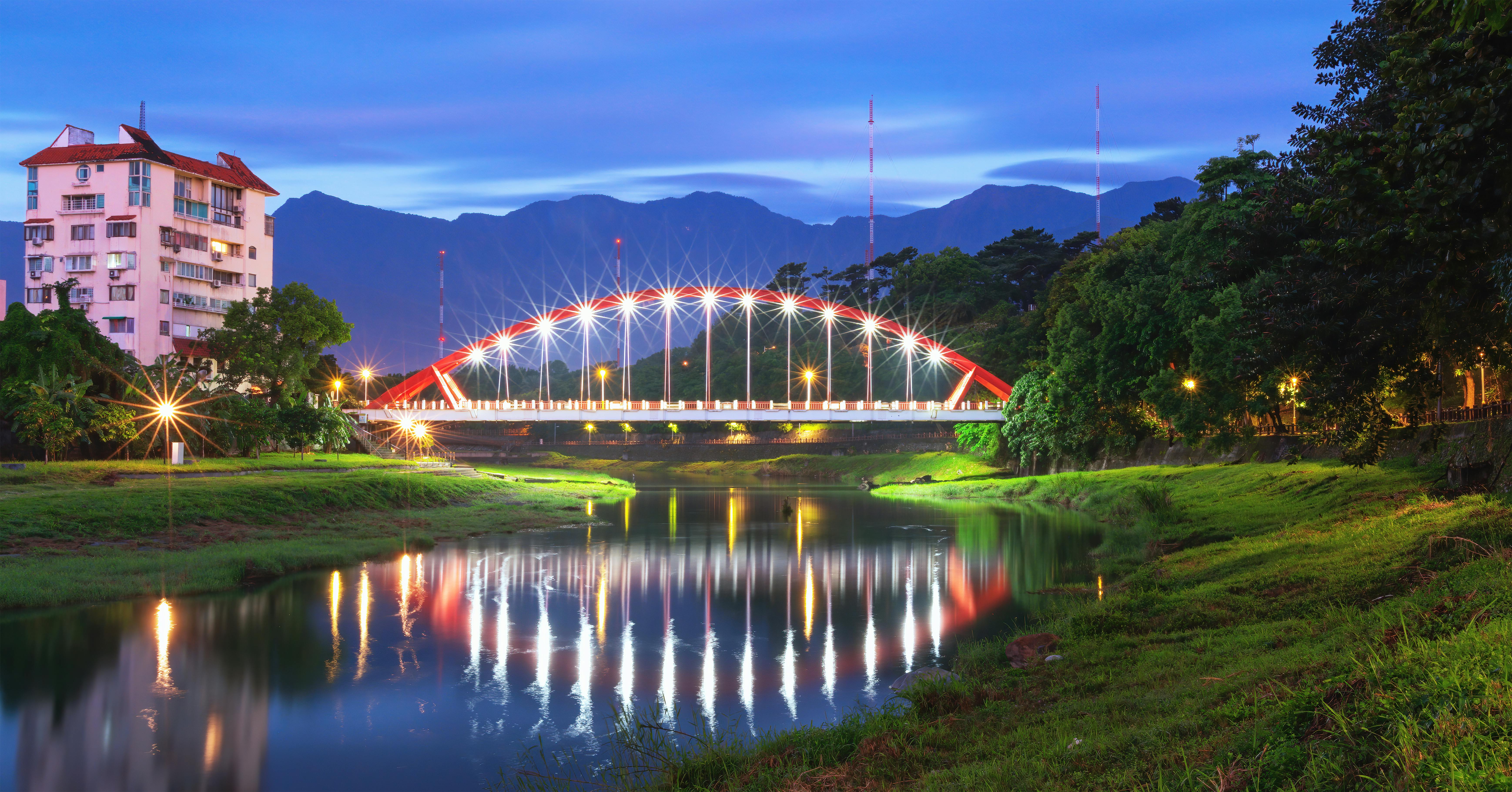 Scenic view of Jinghua Bridge reflecting on the river at twilight in Hualien, Taiwan.