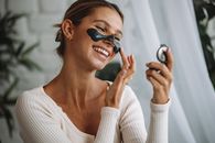 Woman in White Sweater Wearing Black Sunglasses