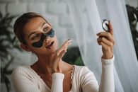 Woman in White Long Sleeve Shirt Wearing Black Sunglasses
