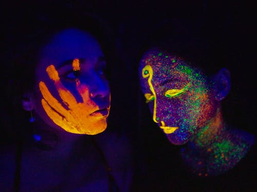A Woman With Neon Face Paint · Free Stock Photo