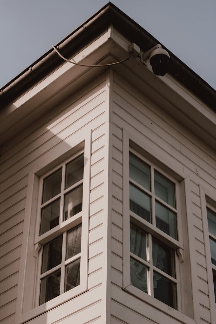 White Wooden Framed Glass Windows Of A House