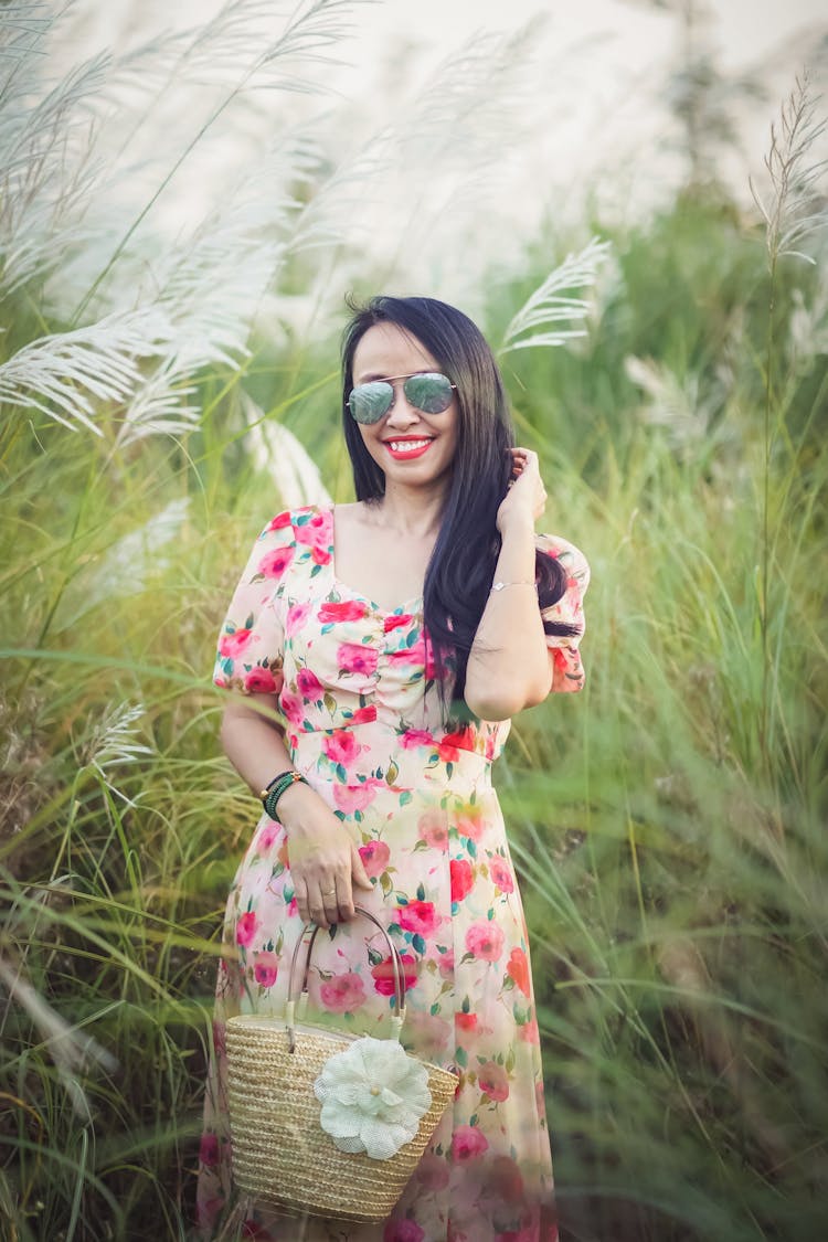 Brunette Woman On A Field In Summer 