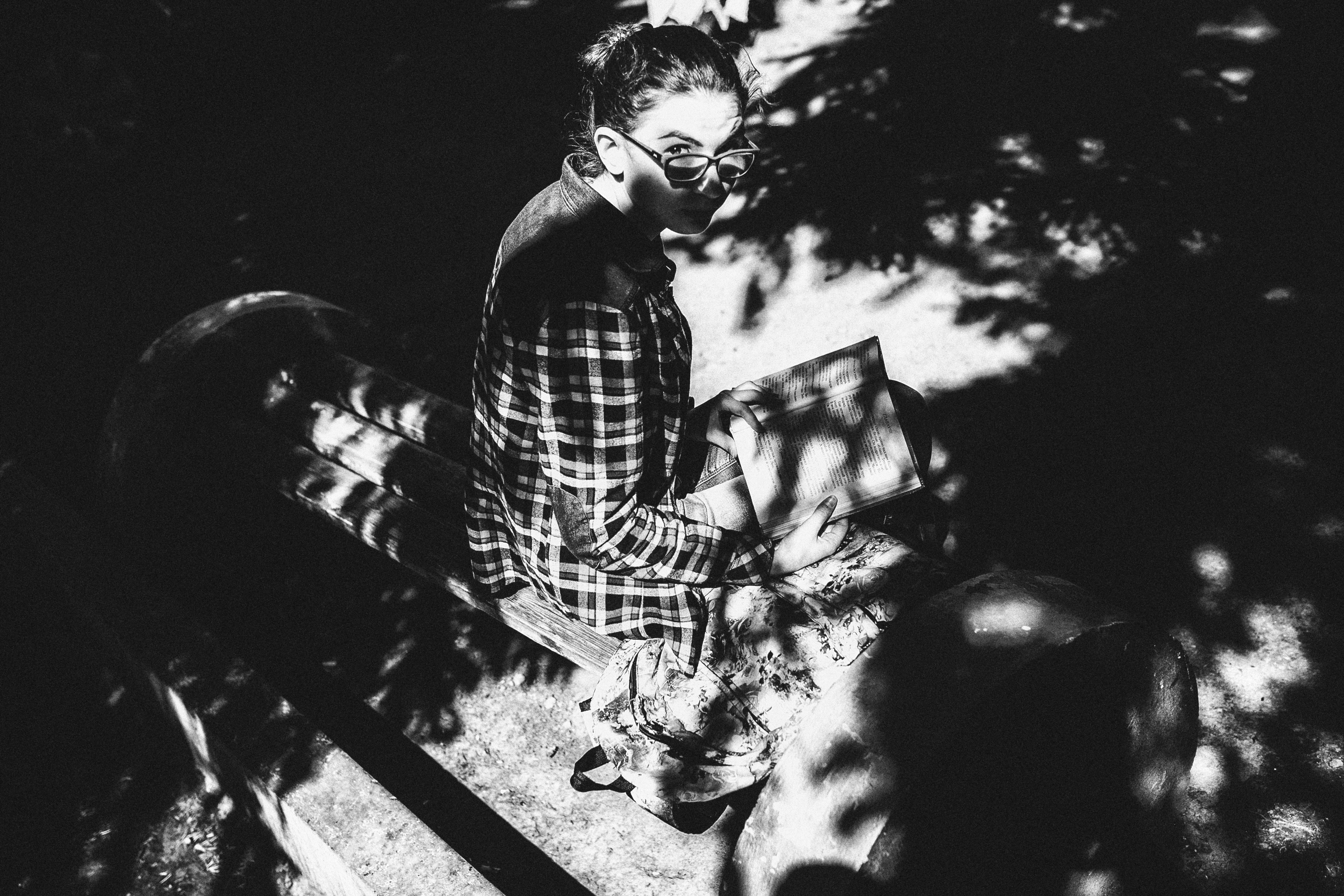 Grayscale Photo Of Women Sitting On Wooden Bench · Free Stock Photo