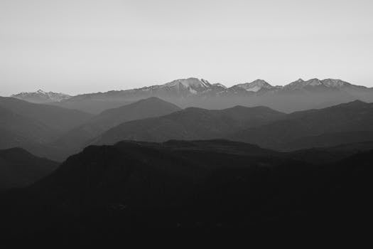 Captivating grayscale view of mountain layers in Adygea, Russia.