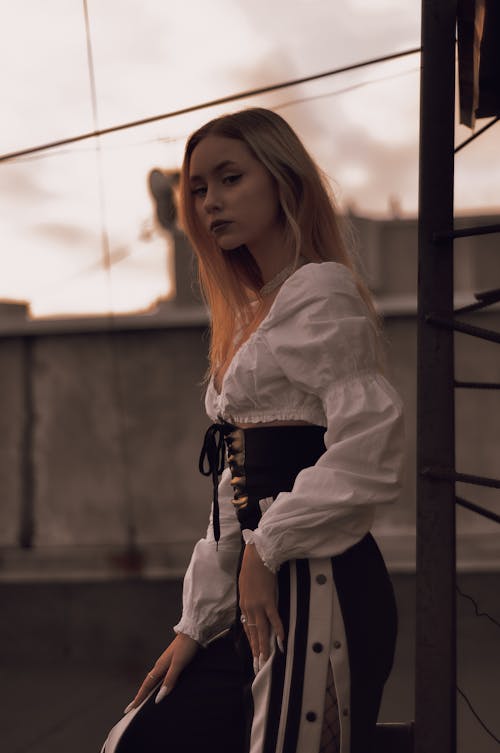 Blonde Hair Woman in Black and White Outfit 