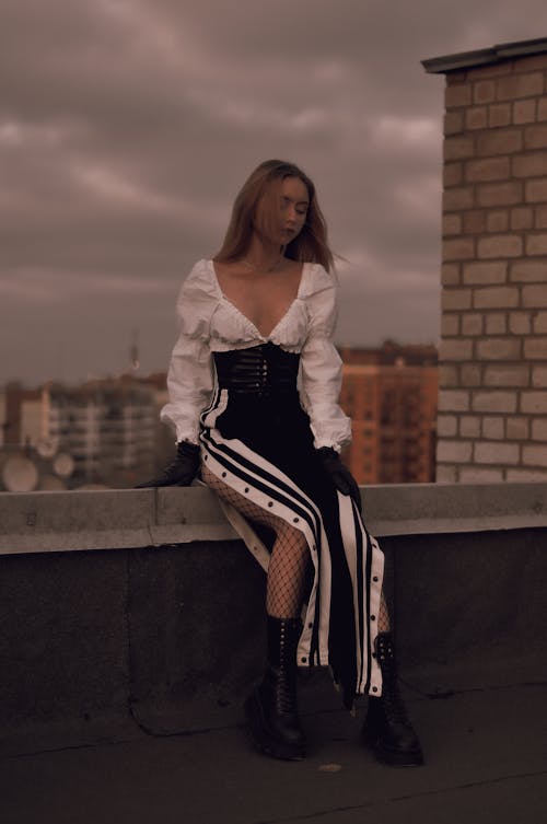 Beautiful Woman Sitting on Rooftop