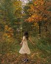 Woman in Floral Dress Spinning Around