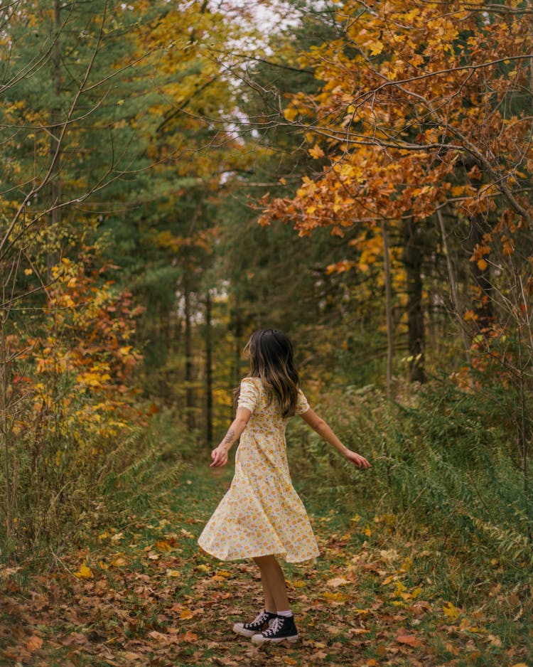 Woman In Floral Dress Spinning Around