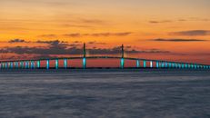 Bridge over Body of Water during Sunset