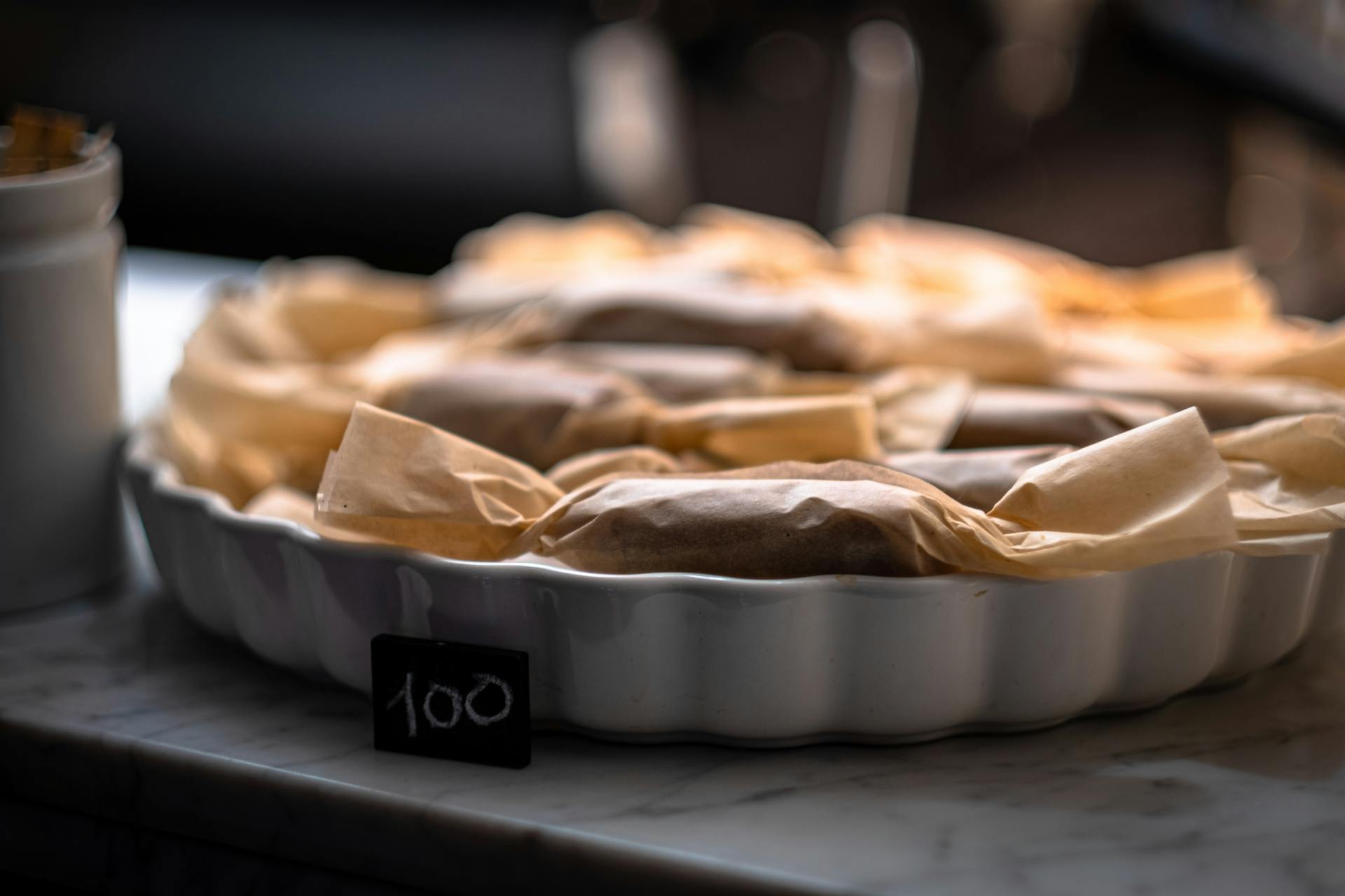 A Price Tag Beside a Tray of Wrapped Food Products
