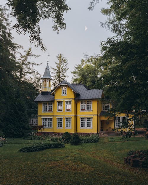 Yellow Mansion Among Trees