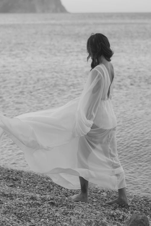 Woman Walking on Beach