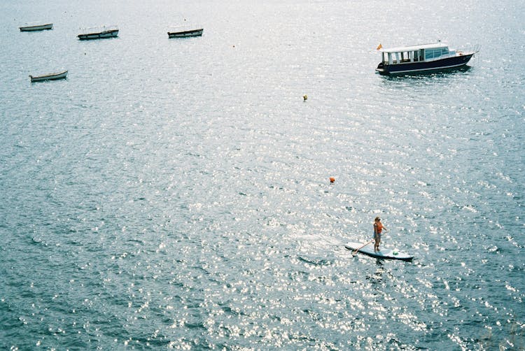 Aerial View Of A Woman Paddling On Her Sap Board