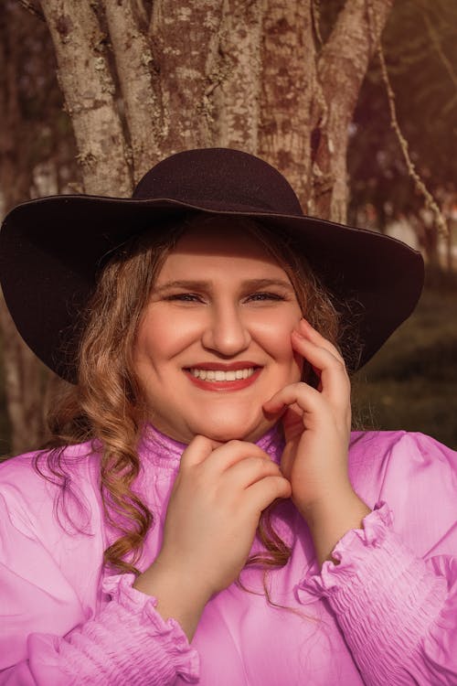 A Woman in Pink Long Sleeve Shirt