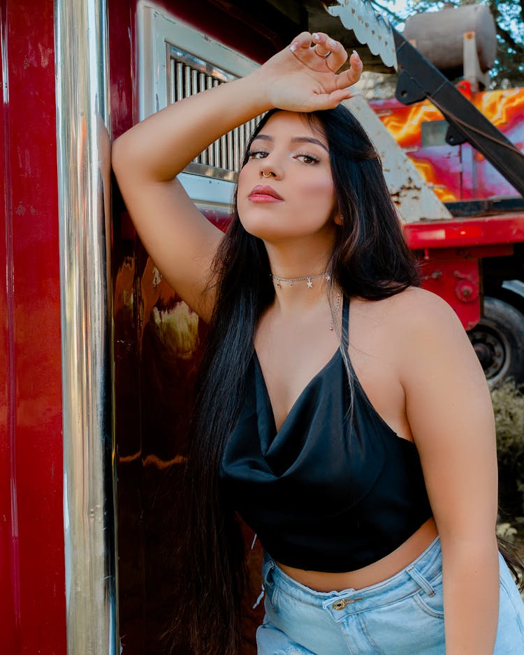 Beautiful Woman Wearing Black Tank Top While Posing