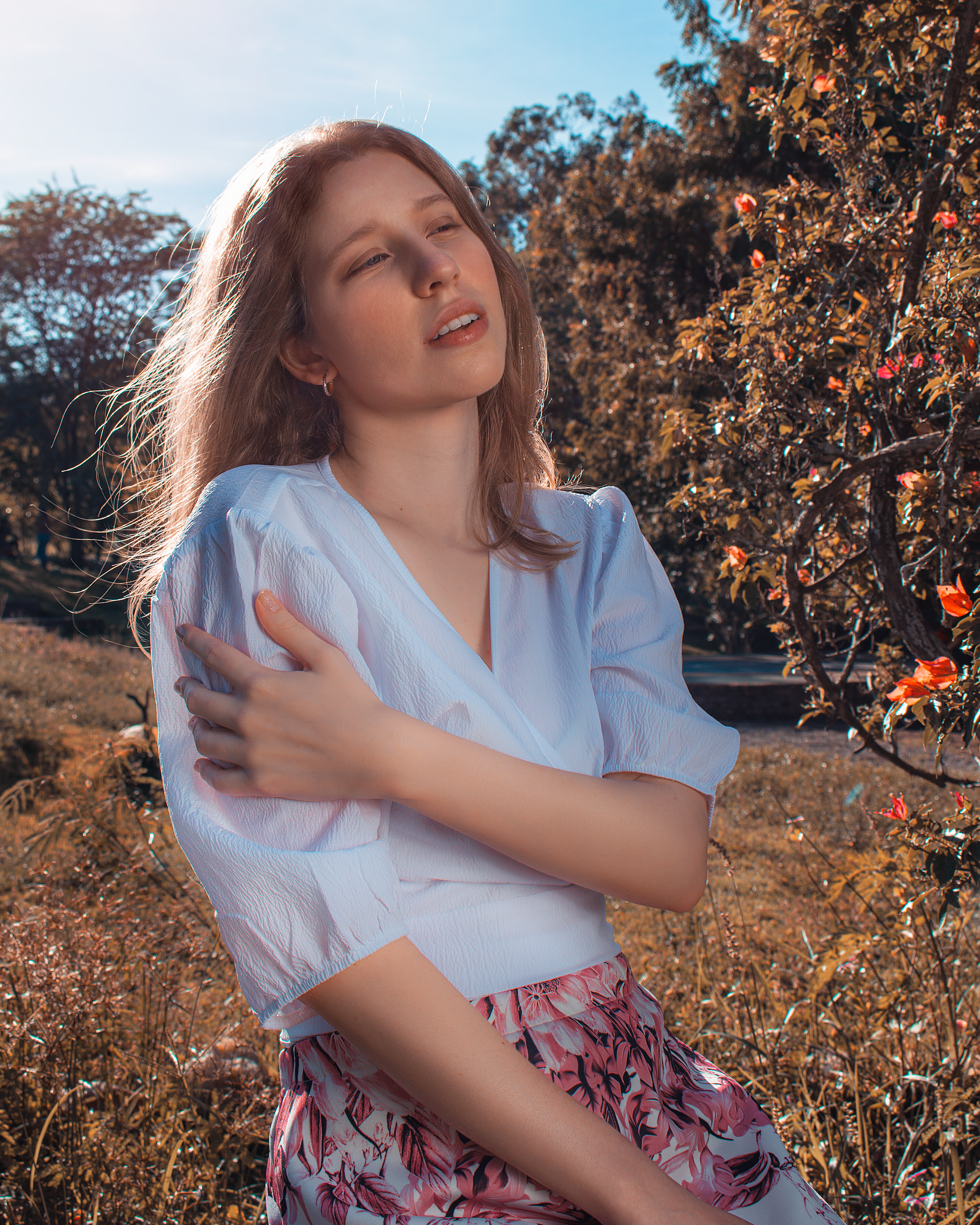 Woman in White Blouse Sitting on Grass · Free Stock Photo