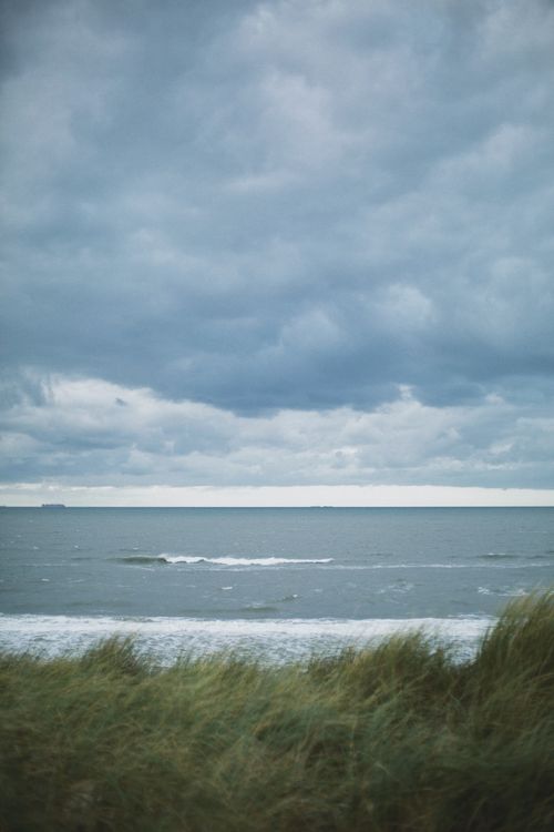 Free Expansive ocean view from Den Helder coastline under cloudy skies. Stock Photo