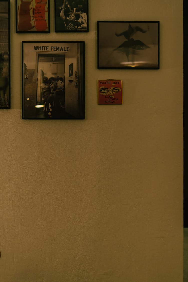 Posters And Pictures In Frames On A Wall