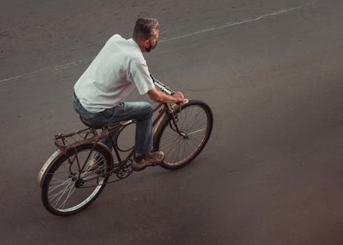 Photos gratuites de adulte, asphalte, bicyclette