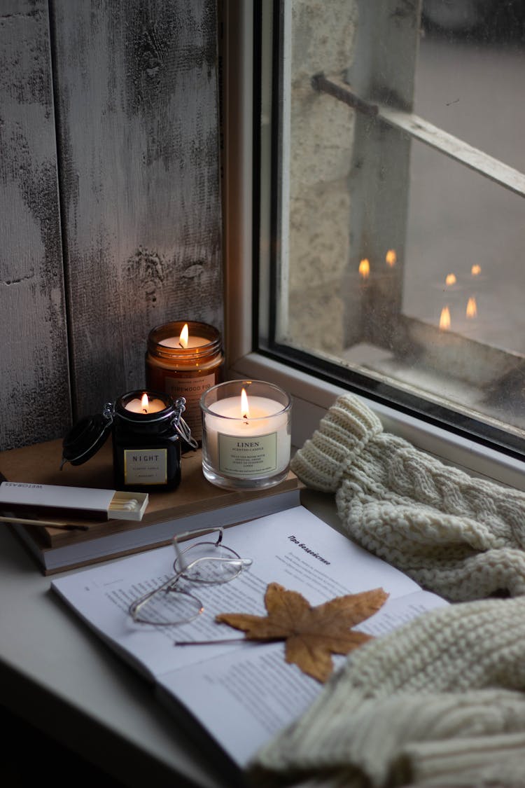 A Lighted Candles By The Window