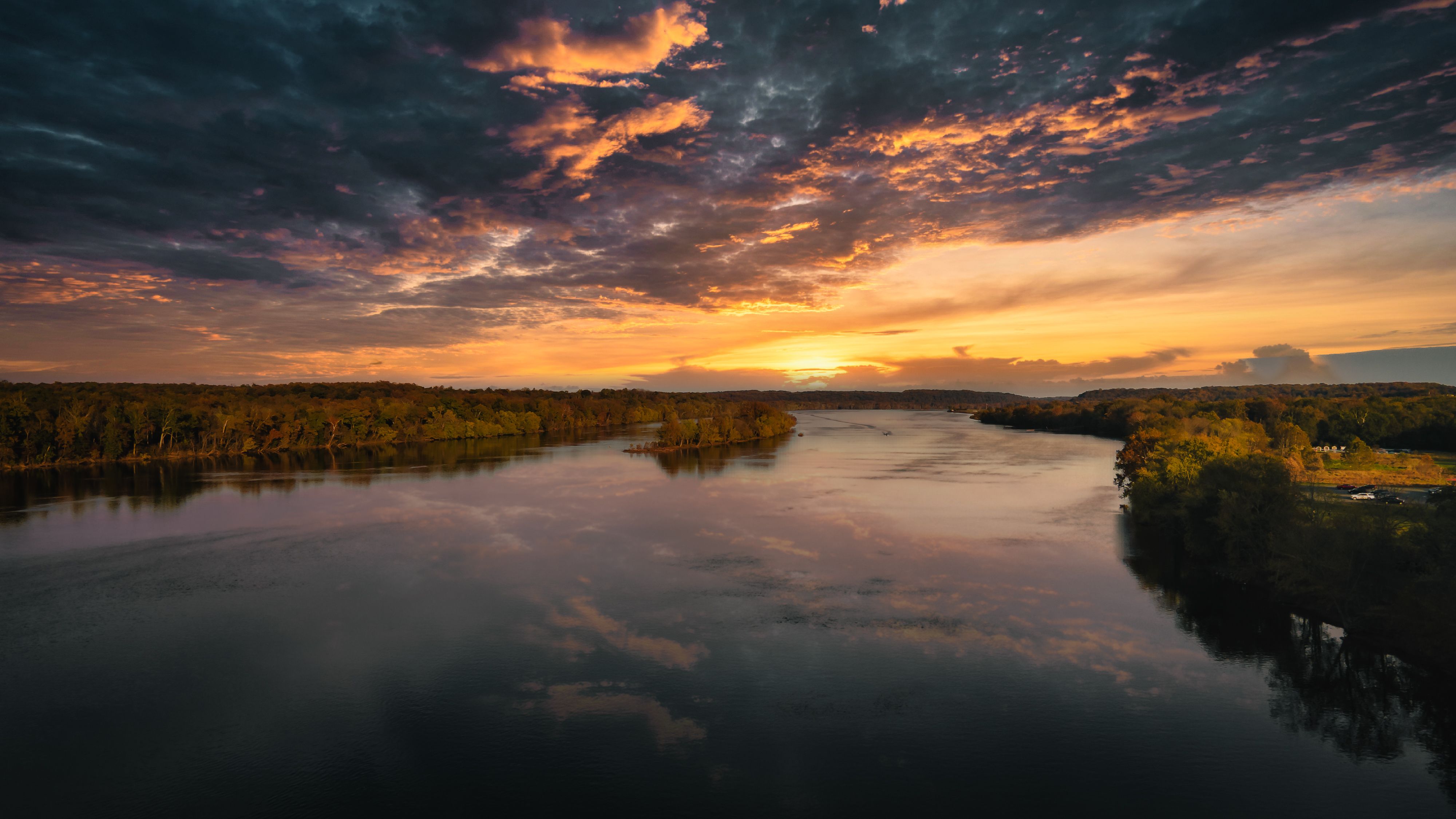 A Beautiful Lake Under Cloudy Sky During Sunset · Free Stock Photo