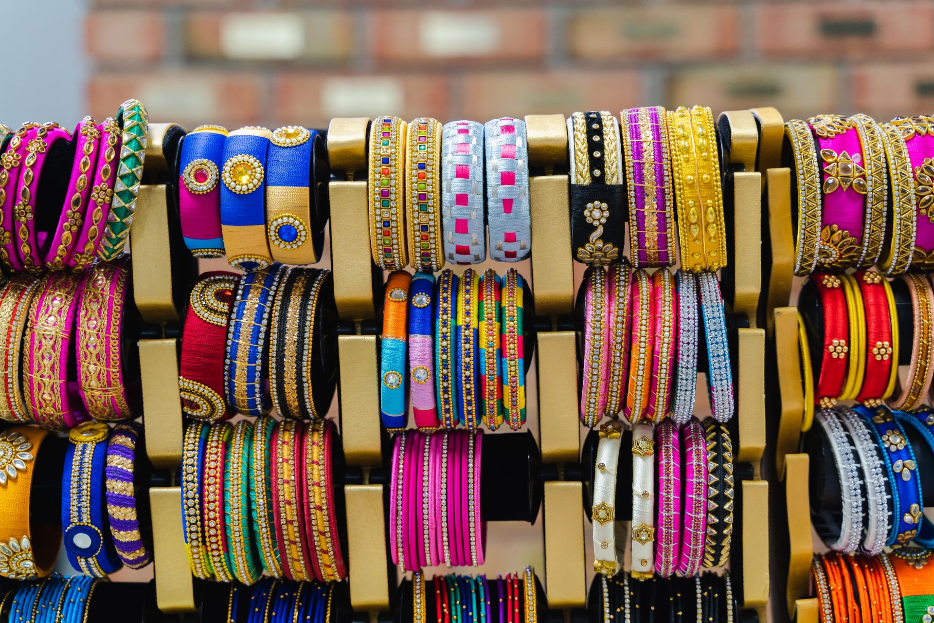 A colorful array of traditional Indian bangles showcasing intricate designs and vibrant colors.