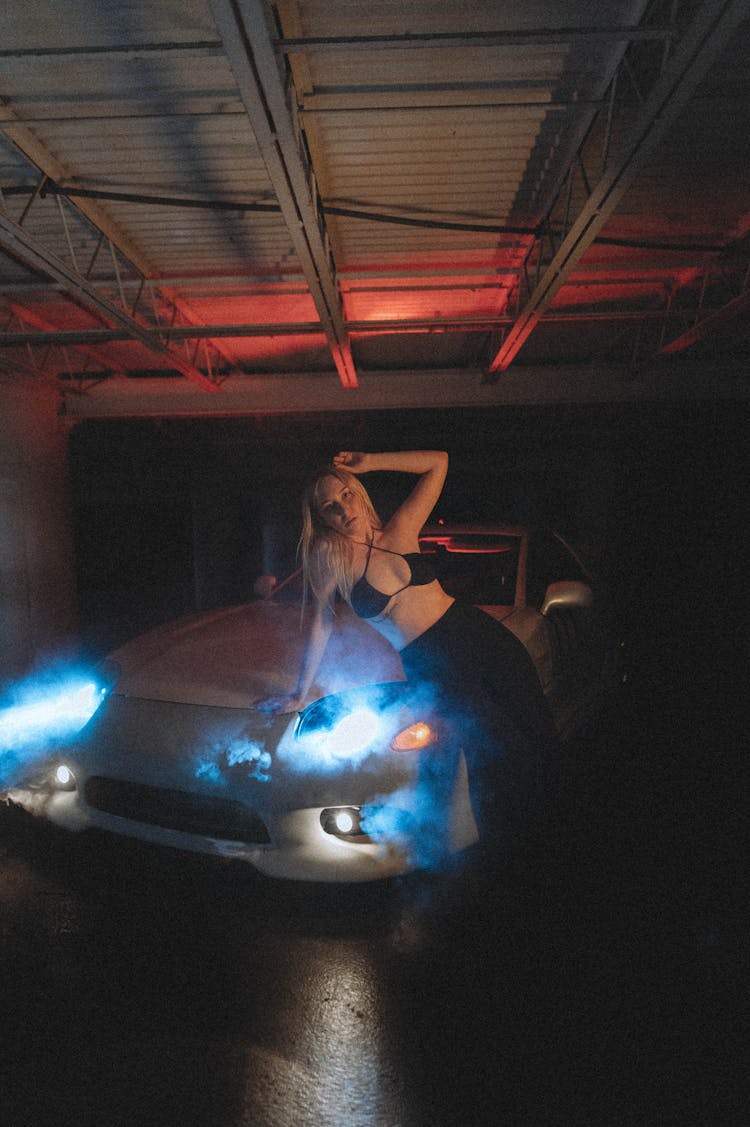 Blonde Woman Leaning On Car