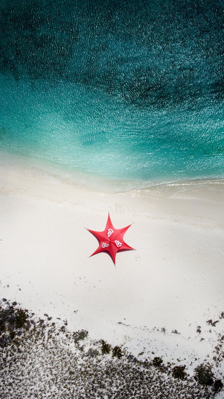 View From Above On Big Umbrella On Beach